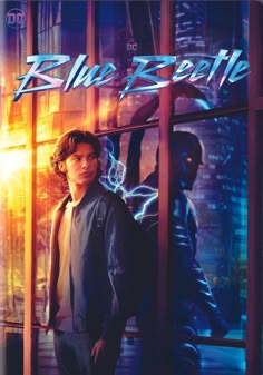 a man standing in front of a window with the words blue beetlele on it