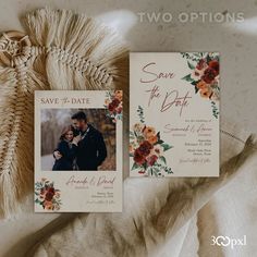 two wedding save the dates cards on top of a blanket