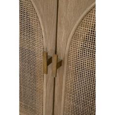 a close up of a wooden door with latticed design on it's sides