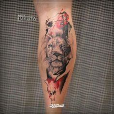 a lion tattoo on the leg with blood dripping from its mouth and head in it