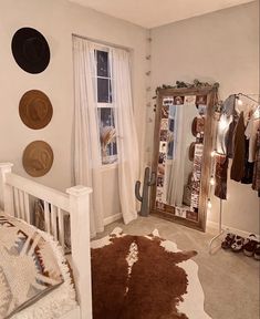 a bedroom with a brown and white cow hide rug