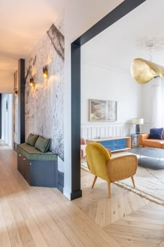 a living room filled with furniture and wooden floors