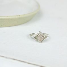 This ring features a diamond shaped Rose Quartz cabochon gemstone in the centre, set in .925 silver. Unique Gemstones