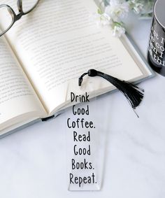 an open book with the words drink good coffee read good books repeat