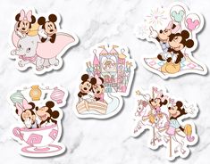 four mickey mouse stickers on a marble surface with the image of minnie and her friends