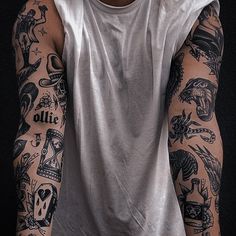 a man with many tattoos on his arms