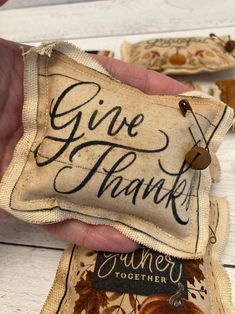 someone is holding some kind of bag that says give thanks