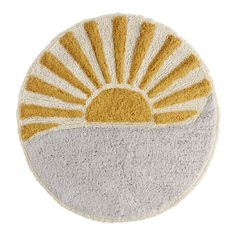 a yellow and white round rug with the sun on it's side, in front of a white background