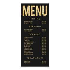 a menu for a restaurant with gold foil lettering on black paper, and the words menu written