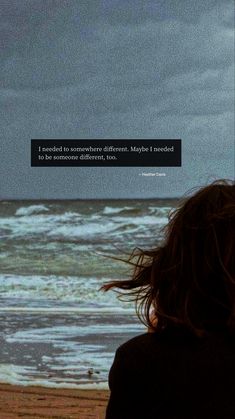 a woman standing on top of a beach next to the ocean with a quote above her head