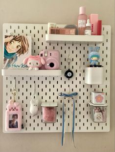 a white peg board with various items on it