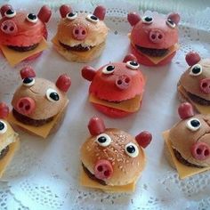 there are many hamburgers shaped like pigs with googly eyes and noses on them