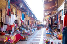 an outdoor market with lots of items for sale