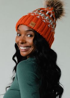 Orange, light blue, mint and olive patterned knit pom hat Natural faux fur pom accent Fleece lined Crown patch on the left side One size 100% Acrylic Beanie With Pom Pom, Beanie With Pom, Knitted Hats Kids, Colorful Hat, Knit Hat For Men, Knit Jewelry, Winter Closet, Blouse Tank Top, Orange Light