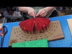 a person is making something out of cardboard