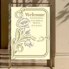 a welcome sign on display in front of a building with the words welcome to our wedding