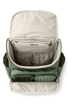 an open green backpack with its contents in the bottom compartment and zippers on the side