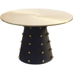 a black and white table with gold rivets on the top, against a white background