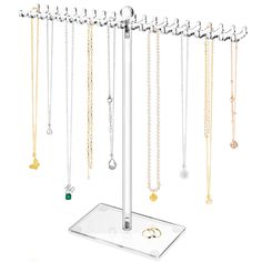 a jewelry rack with several necklaces hanging from it