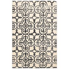 a rug with black and white designs on it