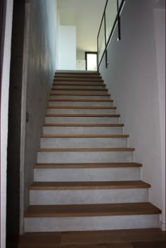 there is a set of stairs leading up to the second floor