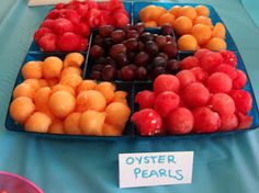 there are many different types of fruits on the table, including cherries and oranges