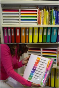 a woman is holding a book in front of some bookshelves with colored papers on them