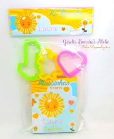 the package is packaged in plastic and has hearts, sunflowers, and other items