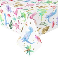 a table cloth with colorful dinosaurs on it