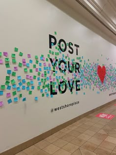 post - it notes adorn the wall of an office lobby in washington, d c