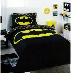 a batman bed in a room with white walls