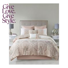 a bed with pink comforter and pillows on it