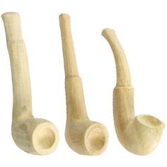 three wooden pipes are lined up in the shape of an animal's tail and head