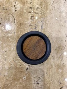 a close up of a wooden object on a counter top with no one around it