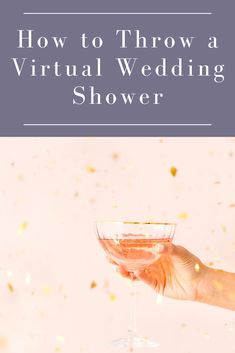 a person holding a wine glass with the words how to throw a virtual wedding shower