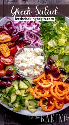 greek salad with olives, tomatoes, cucumbers and feta cheese on a white plate