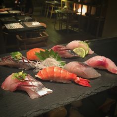 several different types of sushi on a table