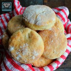 a pile of bread sitting on top of a red and white towel