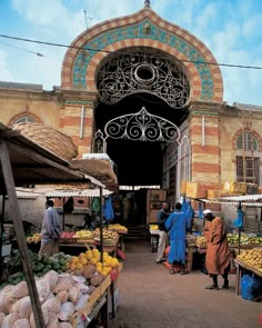 an open air market with fruit and vegetables