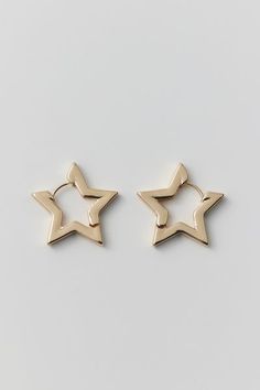 Chunky hoop earrings in a star silhouette that's out-of-this-world. Complete with a latch closure. Content + Care Mixed metal Avoid contact with water Imported Size Dimensions: 1" w | Star Hoop Earring in Gold, Women's at Urban Outfitters Star Earrings Hoop, Urban Outfitters Earrings, Star Hoop Earrings, Star-shaped Tarnish Resistant Hoop Earrings For Everyday, Everyday Gold Star-shaped Hoop Earrings, Gold Plated Star Hoop Earrings, Yellow Gold Star Hoop Earrings, Gold Star-shaped Metal Hoop Earrings, Star Silhouette