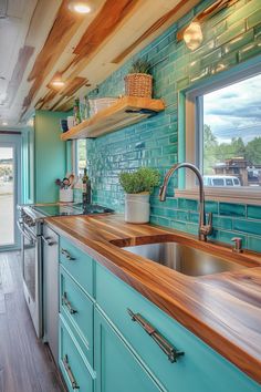 Retro Surf Van Kitchen. Turquoise tile backsplash with wood countertop and aqua cabinetry.  Calling all free-spirited adventurers and vintage lovers! Get ready to fuel your wanderlust and kitchen creativity with our list of 55 vintage surf van kitchen ideas. These aren't just designs, they're hidden gems that'll bring a whole new level of functionality to your classic ride. Oh, and let's not forget…  Read more: https://tastyinteriors.com/generated-post-55-vintage-surf-van-kitchen-ideas/ Van Kitchen Ideas, Kitchen Turquoise, Van Kitchen, Surf Van, Turquoise Tile, Turquoise Kitchen, Wood Countertop, Retro Surf, Vintage Lovers