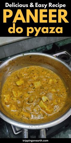 a pan filled with food sitting on top of a stove