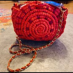 New Women’s Round Straw Cross Bag. 8h 9w 3d. It’s Fully Lined. It’s A Deep Orange Red Color. Gold Chain Has Orange Unique Webbing. It’s Woven Through. 25 Inches In Crossbody Wrap. 2 Inside Zip Pocket. Toggle Closure. Nwt. Red Woven Crochet Bag For Travel, Red Woven Chic Bags, Red Woven Crochet Travel Bag, Chic Red Woven Bags, Red Woven Shoulder Bag For Travel, Handmade Red Crochet Pouch Bag, Trendy Red Crochet Bag For Daily Use, Trendy Red Crochet Bag, Red Woven Bags