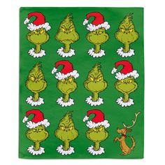 the grin face christmas stickers are on a green background with santa's hats