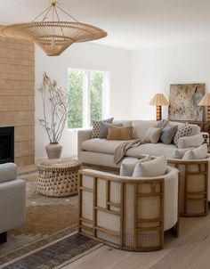 a living room filled with furniture and a fire place