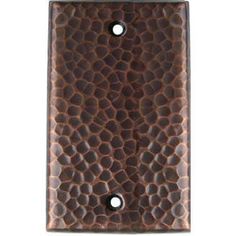 a brown wall plate with two holes in it