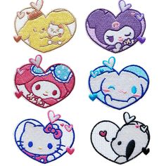 four heart shaped iron - on patches with cartoon characters