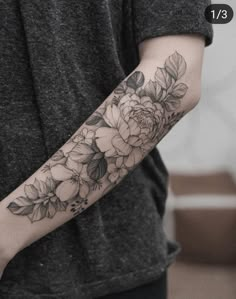 a person with a flower tattoo on their arm