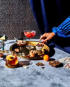 a table topped with different types of food and drinks