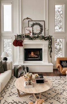 a living room filled with furniture and a fire place in the middle of a room